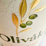Close-up of Oliváki Greek Extra Virgin Olive Oil bottle featuring a gold olive branch design.