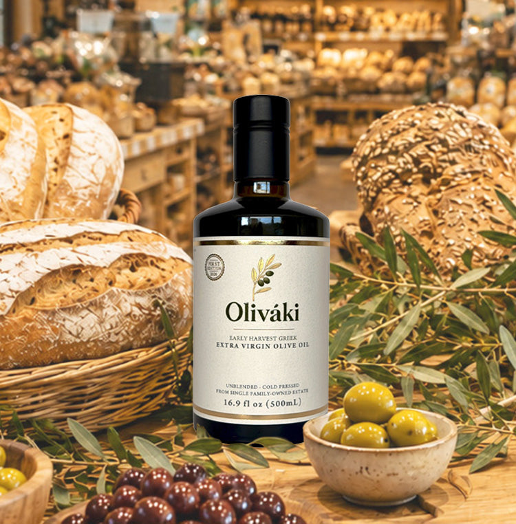 Oliváki Early Harvest Greek Extra Virgin Olive Oil bottle with fresh bread and olives.